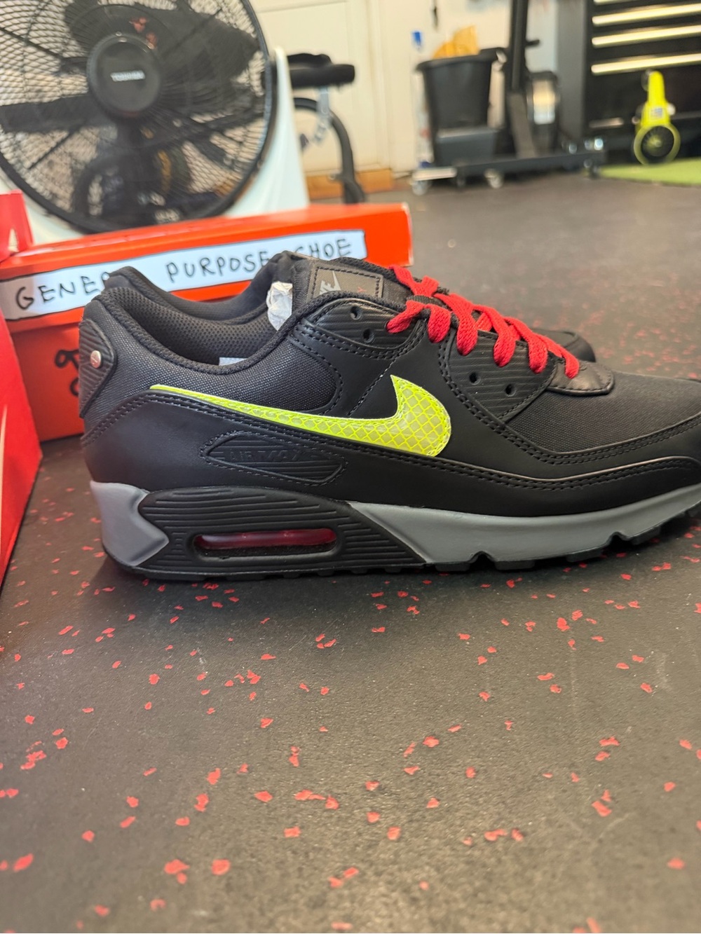 Nike Men’s Black Sneakers with Neon Yellow Swoosh and Red Laces